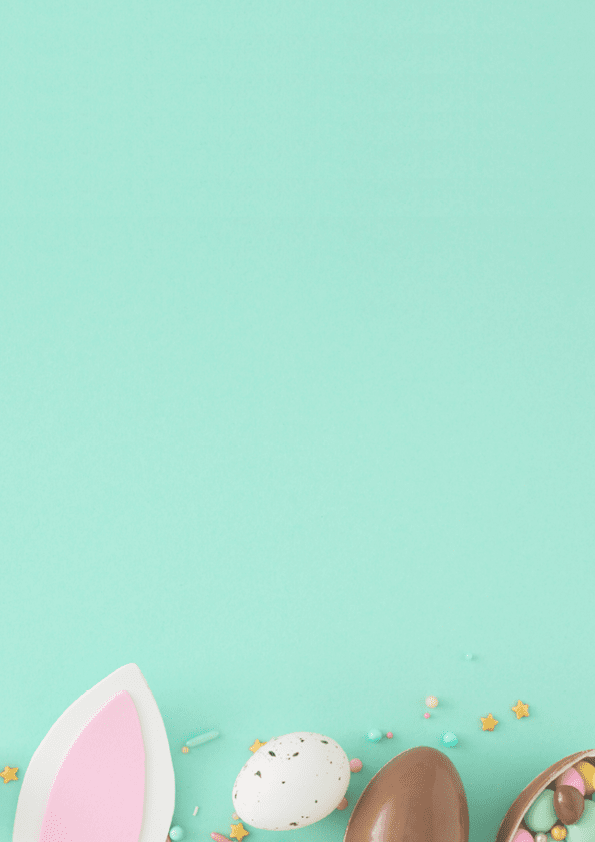 Easter sweets concept. Top view photo of easter bunny ears chocolate eggs with dragees and sprinkles on turquoise background with empty space
