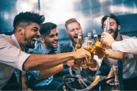Group of young men toasting at a nightclub
