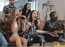 African American sports fans celebrate win at home. Passionate supporters shout crazy watching game on TV. 4K slow motion. Close up. Euphoria. World Championship. Excited and emotional. Entertainment.