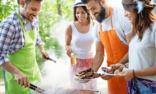 Friends having a barbecue party in nature while having a blast