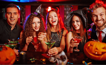 Friends resting in nightclub at Halloween