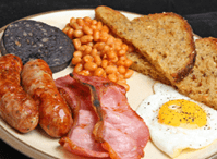 Cooked breakfast with black pudding, baked beans and fried bread 