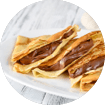 Crepes with chocolate cream close up