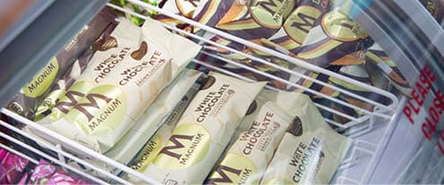 A display case with a variety of chocolate bars. Description generated by AI