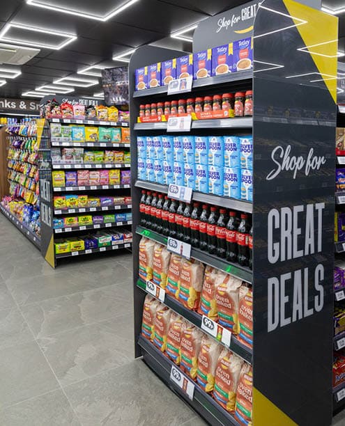 A store with a sign that says “Great Deals". Description generated by AI