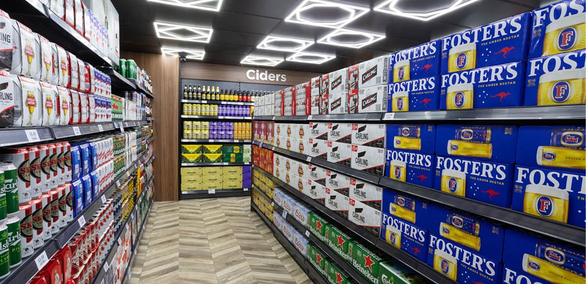A store with a large selection of beer bottles. Description generated by AI