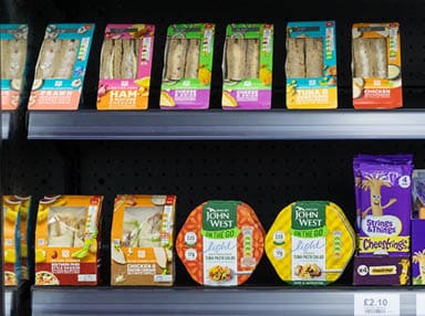 A grocery store with a variety of food items. Description generated by AI