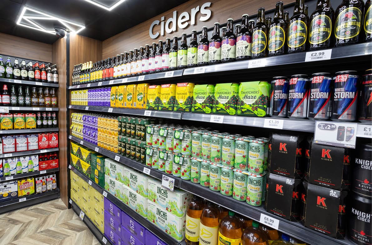 A store aisle with a variety of beverages. Description generated by AI