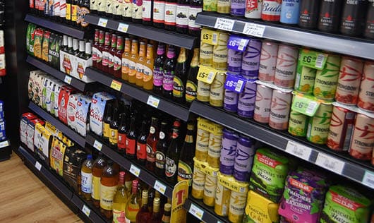 A store with a large selection of beer and soda. Description generated by AI