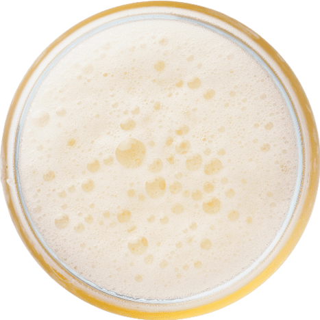 Four glasses of beer with foam on top. Description generated by AI