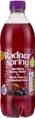 A bottle of red juice with black cherries and black currant. Description generated by AI