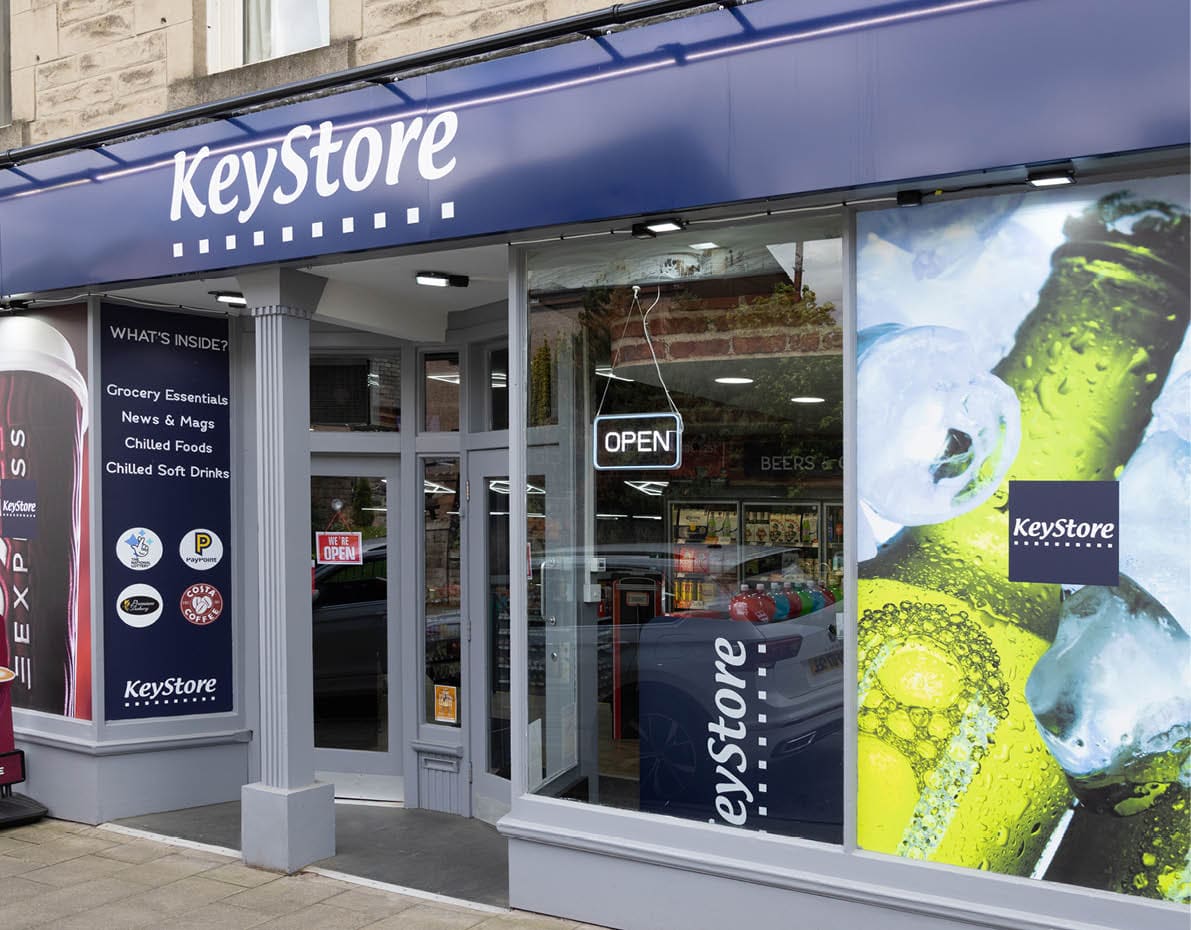 A storefront with a blue awning and a sign that says “Keg Store." Description generated by AI