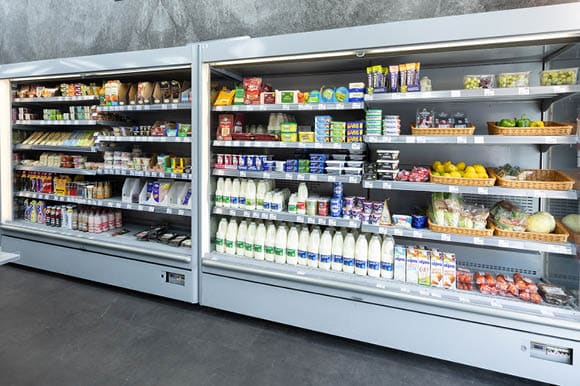 A refrigerator with milk and other food items. Description generated by AI