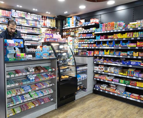 A store with a lot of candy and drinks. Description generated by AI