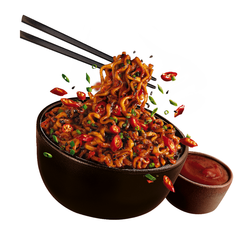 A bowl of spicy noodles garnished with chopped green onions and red chili peppers is being lifted with chopsticks next to a small bowl of red sauce. Description generated by AI