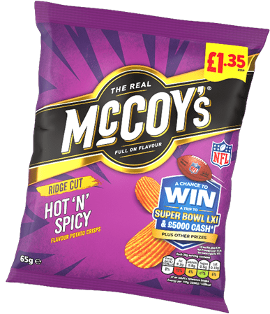 A purple bag of McCoy's Ridge Cut Hot 'N' Spicy flavored potato crisps with a promotional offer to win a trip to the Super Bowl and cash prizes. Description generated by AI
