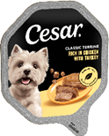 Packaging for Cesar Classic Terrine dog food featuring a small dog and pieces of the food on a plate. Description generated by AI