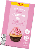 A pink box of Local Living Baking Cupcake Kit with an image of a cupcake topped with pink frosting and colored sprinkles, priced at £2.29 and including cupcake mix, pink frosting mix, colored sprinkles, cupcake cases, and piping bag. Description generated by AI
