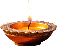 A close-up of a lit wick burning in a decorative oil lamp with a warm orange glow. Description generated by AI