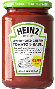 A jar of Heinz sun-ripened cherry tomato and basil sauce with a green lid labeled 100% natural ingredients and a price tag on the front. Description generated by AI