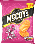 A bright pink bag of McCoy's Ridge Cut Sizzling King Prawn flavored potato crisps with an image of two ridged crisps and a price label. Description generated by AI
