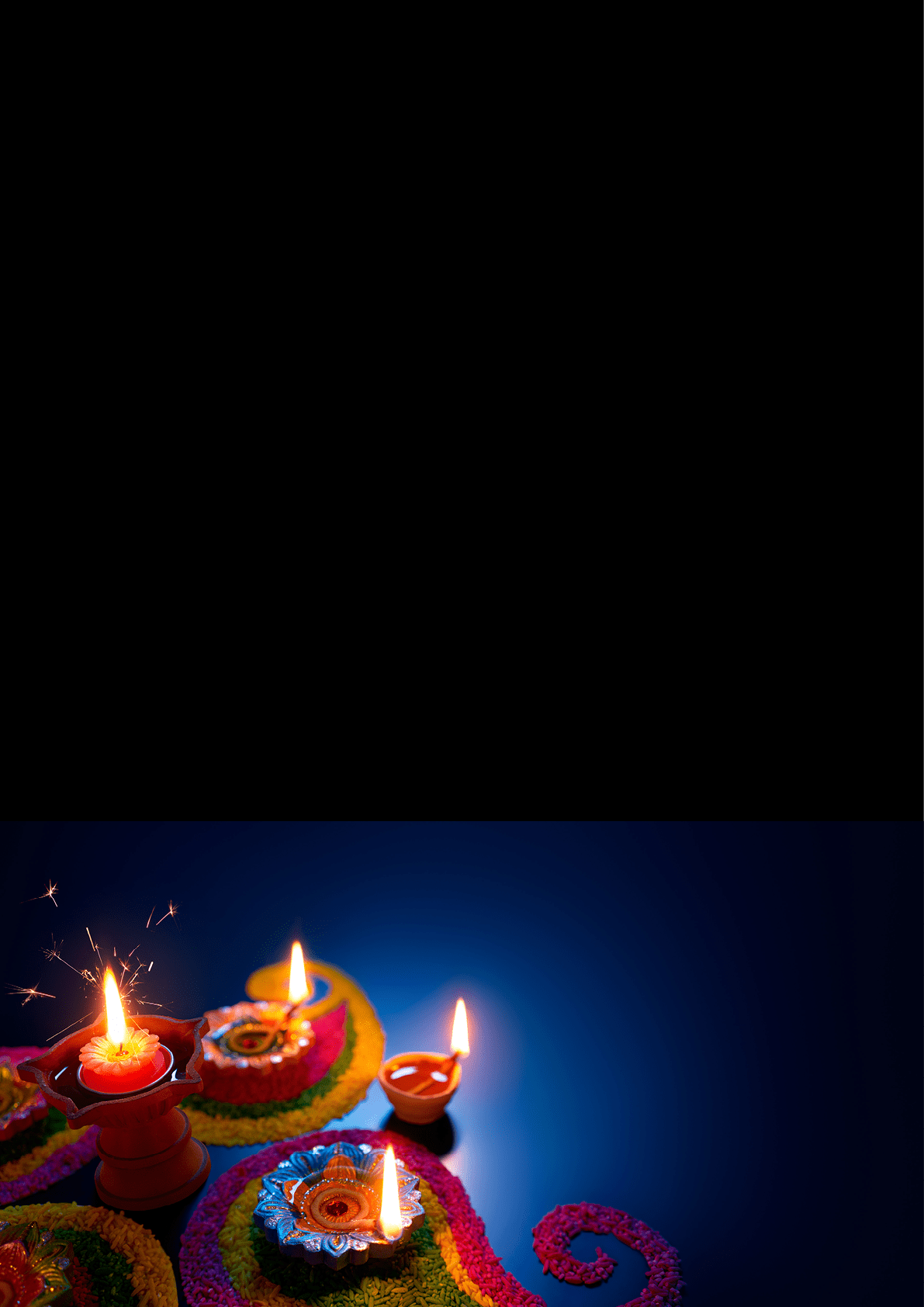 Decorative clay oil lamps with flames are placed on colorful rangoli patterns against a dark background. Description generated by AI